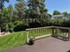 Wide planked deck overlooking the lawn and treed yard at 18655 E Garden Pl, Aurora, CO 80015