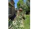 Multi-level deck looking out over a grassy backyard and treed perimeter at 18655 E Garden Pl, Aurora, CO 80015