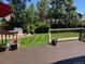 Deck view to a backyard with fresh grass and a small playhouse at 18655 E Garden Pl, Aurora, CO 80015