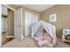 Inviting bedroom showcasing a tent, plush carpet, and ample natural light at 18655 E Garden Pl, Aurora, CO 80015