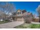 Attractive two-story home with a three-car garage, showcasing a well-maintained front yard at 18655 E Garden Pl, Aurora, CO 80015