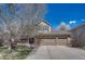 Charming two-story home featuring a spacious three-car garage and welcoming front porch at 18655 E Garden Pl, Aurora, CO 80015