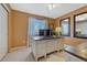 Inviting home office with a large desk, natural light, and stylish decor at 18655 E Garden Pl, Aurora, CO 80015