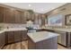 Well-appointed kitchen featuring granite countertops, stainless steel appliances, and dark wood cabinetry at 18655 E Garden Pl, Aurora, CO 80015