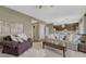 A cozy living room connected to the kitchen that includes a plush sofa and a coffee table at 18655 E Garden Pl, Aurora, CO 80015