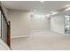 Spacious finished basement boasts neutral carpet, paint and stairs at 3177 S Grant St, Englewood, CO 80113