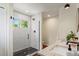 Updated bathroom features stylish glass shower and dual sinks with white countertop at 3177 S Grant St, Englewood, CO 80113