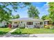 Charming home with a well-manicured lawn, sidewalk and beautiful landscaping in front at 3177 S Grant St, Englewood, CO 80113