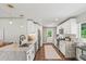 Modern kitchen with white cabinets, stainless steel appliances, and granite countertops at 3177 S Grant St, Englewood, CO 80113