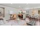 Bright, open-concept living room featuring modern decor, hardwood floors, and seamless flow to the kitchen at 3177 S Grant St, Englewood, CO 80113