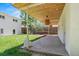 Covered patio with wood ceiling, pendant lighting, and view of fenced backyard at 3177 S Grant St, Englewood, CO 80113