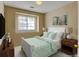 Bedroom with a comfortable bed, closet, and natural light from the window at 3281 E 103Rd Pl # 1403, Thornton, CO 80229