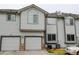Exterior view of the townhome featuring two garages at 3281 E 103Rd Pl # 1403, Thornton, CO 80229