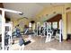Community gym with various exercise equipment, mirrors, and good lighting at 3281 E 103Rd Pl # 1403, Thornton, CO 80229