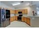 View of kitchen features stainless steel appliances, wood cabinets, and recessed lighting at 3281 E 103Rd Pl # 1403, Thornton, CO 80229