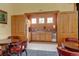 Kitchenette with sink, refrigerator, cabinets, and tables with chairs in the common area at 3281 E 103Rd Pl # 1403, Thornton, CO 80229