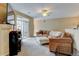 Comfortable living room featuring carpeted floors and a ceiling fan at 3281 E 103Rd Pl # 1403, Thornton, CO 80229