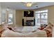 Inviting living room with carpet, ceiling fan, and access to outdoor balcony at 3281 E 103Rd Pl # 1403, Thornton, CO 80229