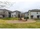 Community playground on a well-manicured green lawn surrounded by residential buildings at 3281 E 103Rd Pl # 1403, Thornton, CO 80229
