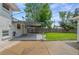Spacious backyard featuring a concrete patio and green lawn, perfect for outdoor activities and relaxation at 5315 Newland St, Arvada, CO 80002