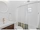 Bright bathroom featuring white subway tile, modern fixtures, and a clean, updated design at 5315 Newland St, Arvada, CO 80002