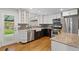 Modern kitchen featuring stainless appliances, granite countertops, and sleek cabinetry at 5315 Newland St, Arvada, CO 80002