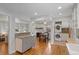 Inviting eat-in kitchen featuring stainless appliances, granite countertops, and a convenient washer and dryer at 5315 Newland St, Arvada, CO 80002