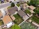 Aerial view capturing a home with a spacious backyard, a detached garage, and a charming patio area at 160 Northglenn Dr, Northglenn, CO 80233