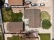 An aerial of a house with a well-kept lawn and landscaping, plus a detached garage and small patio in the backyard at 160 Northglenn Dr, Northglenn, CO 80233
