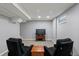 Finished basement featuring carpeted floors, two arm chairs, and a flat screen tv at 160 Northglenn Dr, Northglenn, CO 80233