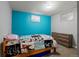 Comfortable bedroom featuring carpeted floors, modern dresser, and colorful decor at 160 Northglenn Dr, Northglenn, CO 80233