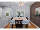 Dining area showcasing hardwood floors, elegant lighting, and a stylishly set table at 160 Northglenn Dr, Northglenn, CO 80233