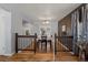 Dining area showcasing hardwood floors, elegant lighting, and seating for four at 160 Northglenn Dr, Northglenn, CO 80233