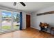Cozy living room with hardwood floors, large window for natural light and vintage accents at 160 Northglenn Dr, Northglenn, CO 80233