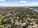 Expansive aerial view of a residential neighborhood with mature trees and easy access to city amenities at 160 Northglenn Dr, Northglenn, CO 80233