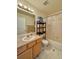 Well-lit bathroom with a single sink and shower-tub combo at 395 Longspur Dr, Brighton, CO 80601