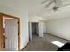 Spacious bedroom with an ensuite bathroom and access to a hallway at 395 Longspur Dr, Brighton, CO 80601