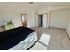 Spacious bedroom with carpet floors, ceiling fan, and plenty of natural light at 395 Longspur Dr, Brighton, CO 80601
