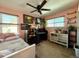 Stylish bedroom with ceiling fan, ample shelving, and unique decorations at 395 Longspur Dr, Brighton, CO 80601