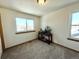 Bright bedroom with large window and natural light at 395 Longspur Dr, Brighton, CO 80601