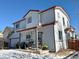 Two-story home with attached garage and backyard at 395 Longspur Dr, Brighton, CO 80601