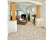 Open concept living space with a fireplace and hardwood floors at 395 Longspur Dr, Brighton, CO 80601