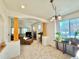 Open-concept space with natural light, a dining area, and a comfortable living space at 395 Longspur Dr, Brighton, CO 80601