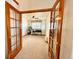 Bright office space with glass doors, neutral carpet, and large window at 395 Longspur Dr, Brighton, CO 80601