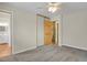 Neutral bedroom features a ceiling fan, closet, and light gray carpet at 4425 S Zang St, Morrison, CO 80465
