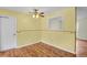 Bright dining room with laminate wood flooring, neutral walls and ceiling fan at 4425 S Zang St, Morrison, CO 80465