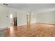 Spacious living room with hardwood flooring, bright neutral walls, with doorways to other rooms at 4425 S Zang St, Morrison, CO 80465