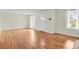 Bright and open living room featuring hardwood floors, large windows, and a welcoming atmosphere at 4425 S Zang St, Morrison, CO 80465
