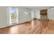 View of fireplace, front door and large windows in open living room at 4425 S Zang St, Morrison, CO 80465