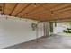 Attached patio with wood covering and lights, perfect for entertaining and accessed from the home's exterior at 4425 S Zang St, Morrison, CO 80465